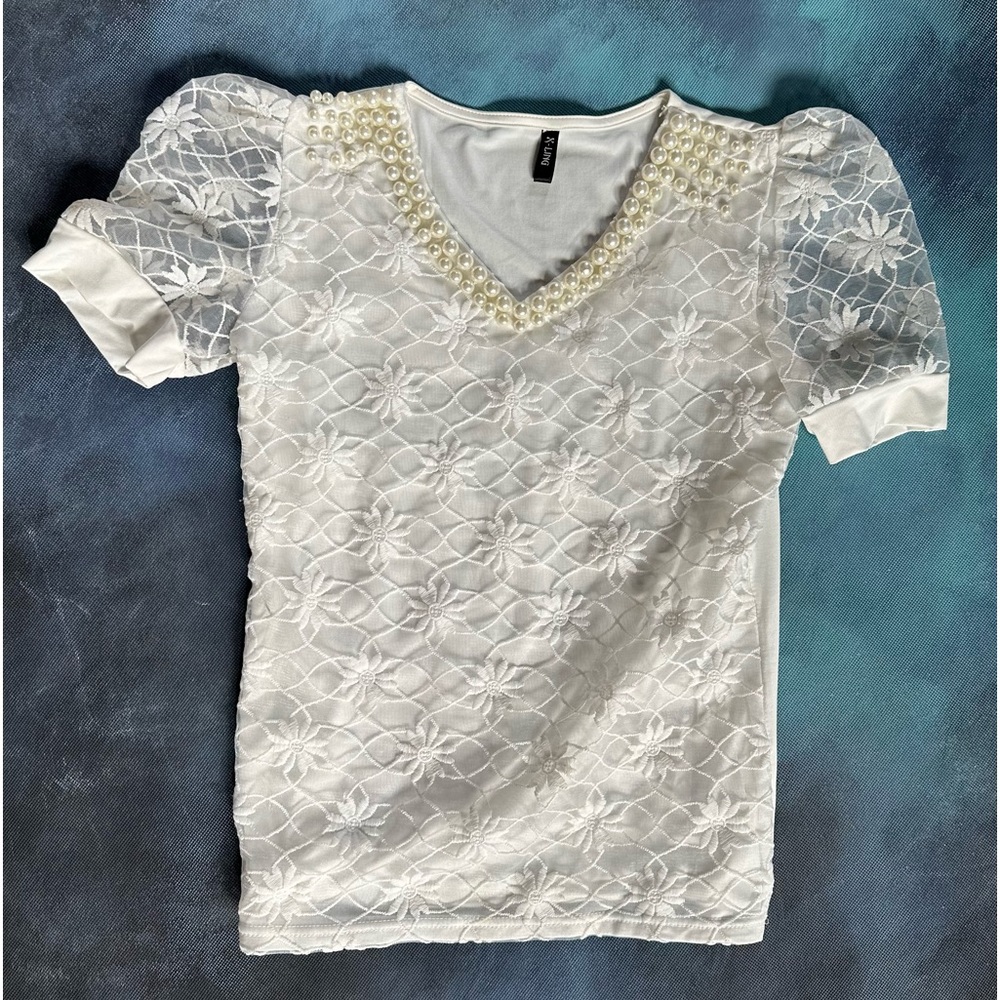 Off white jeweled top